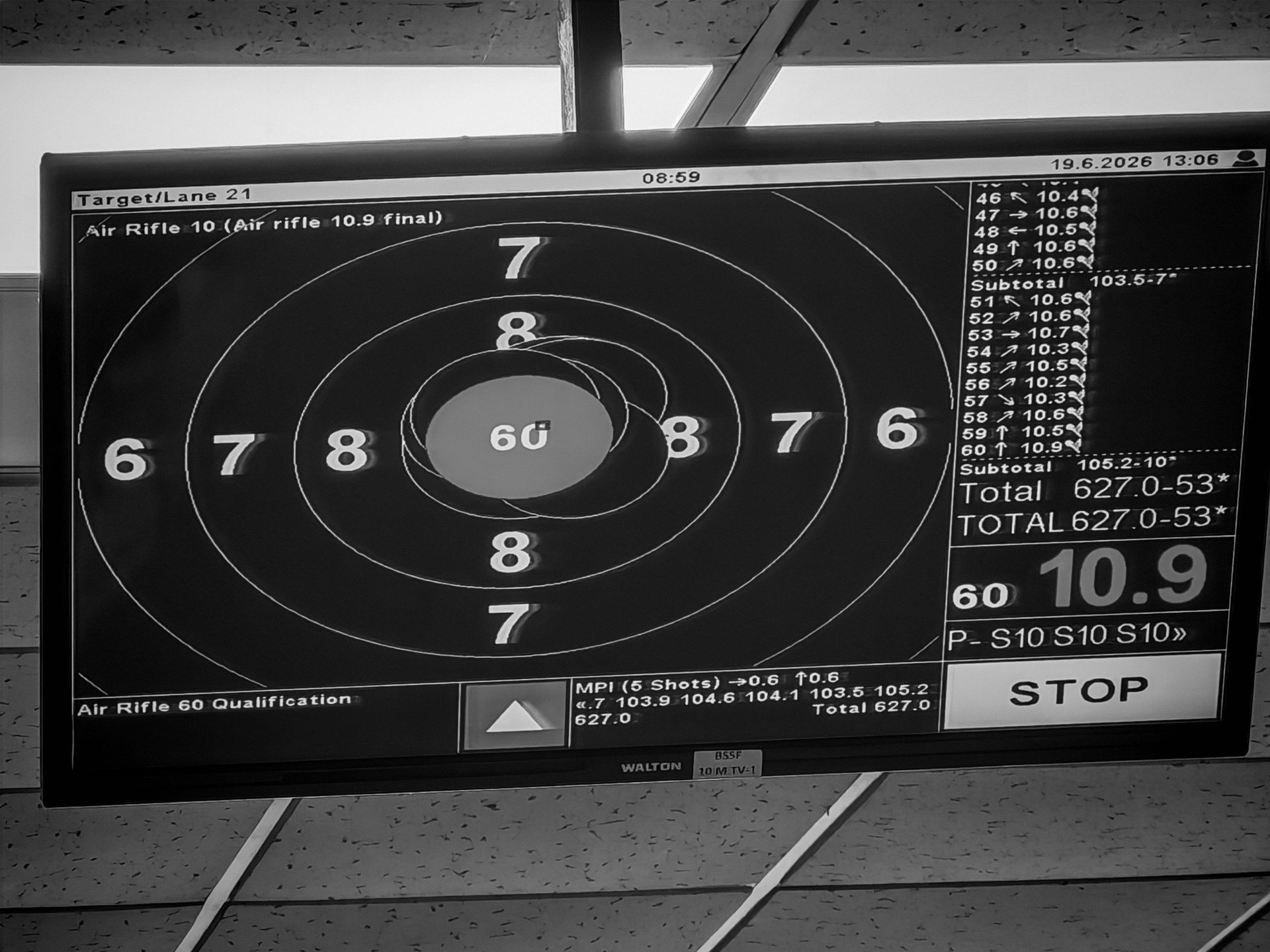 Electronic scoreboard reading a 10.9 final shot and a 627.0 aggregate